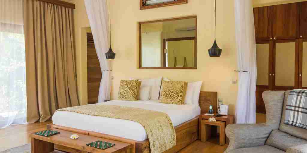 white sand villas luxury bedroom zanzibar tanzania yellow zebra safaris