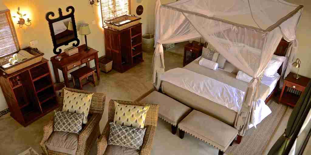 15. Imvelo Safari Lodges   Camelthorn Lodge   King bed configuration Forest Villa
