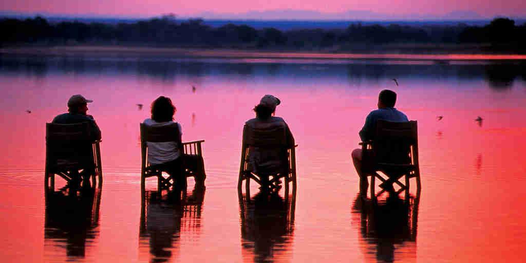 pink sunset, sundowners in zambia, africa safaris