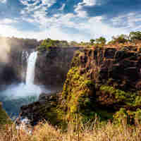 sun beam through victoria falls, zimbabwe safaris