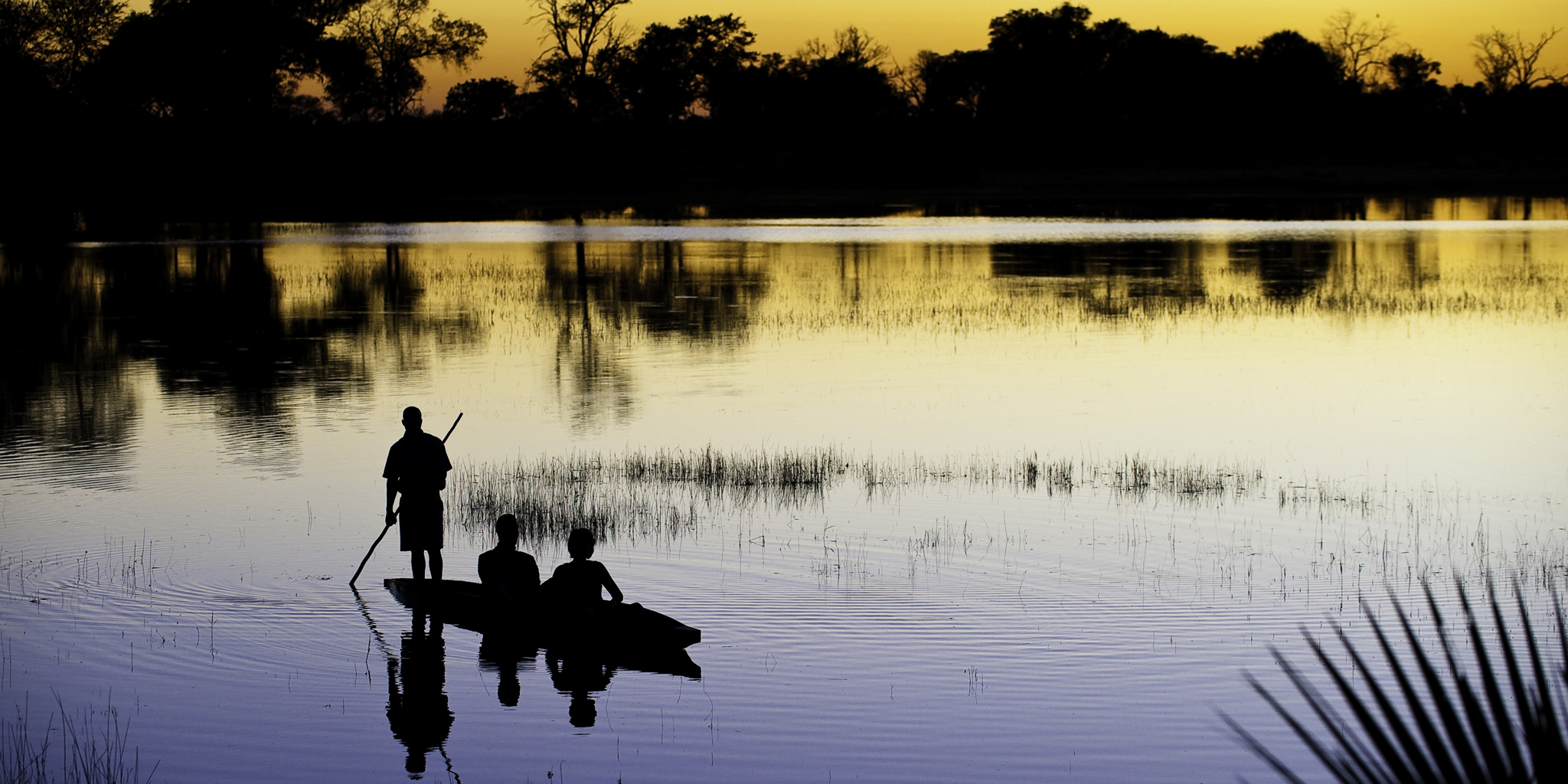 mokoro safari during sunset, botswana experiences, africa 