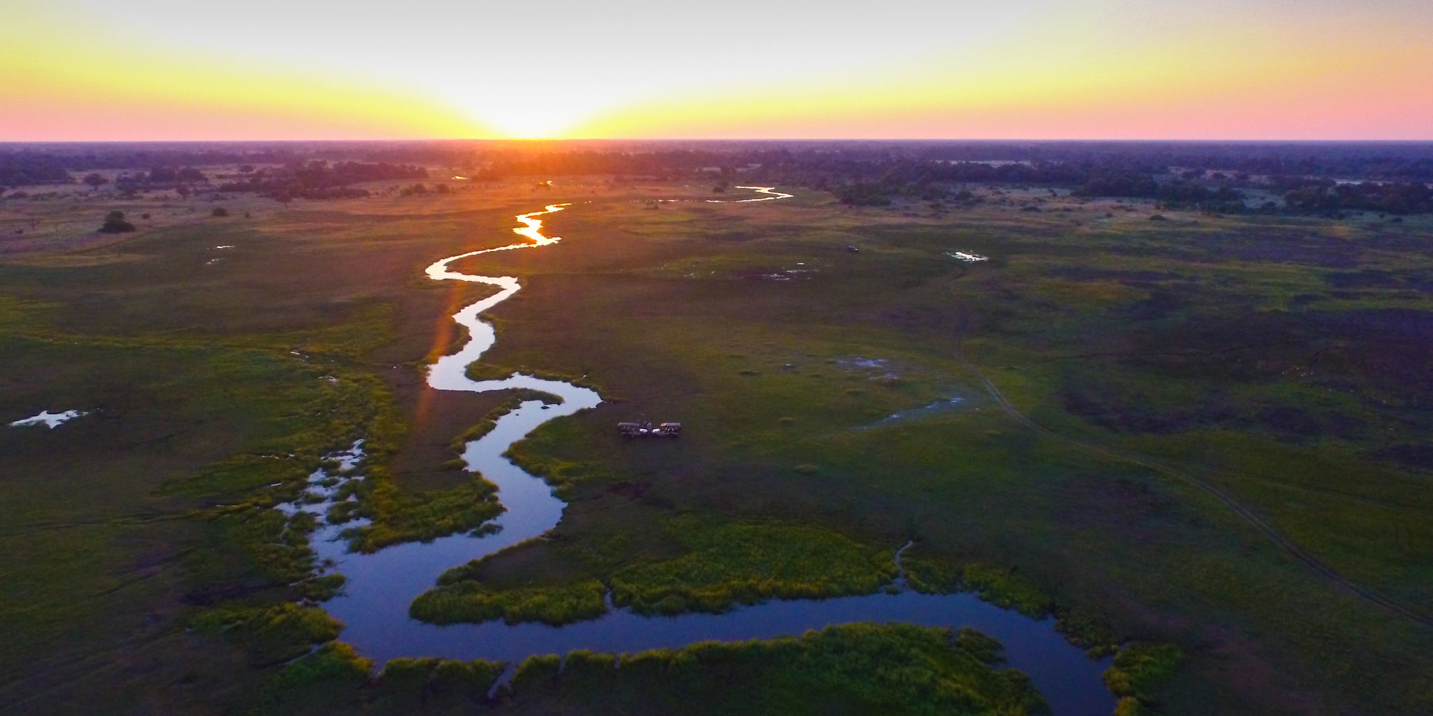 sunset over khwai, botswana safaris, africa vacations