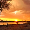 orange sunset over khwai safari park, botswana vacations
