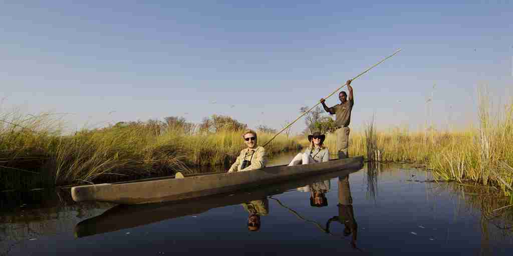 guests on a mokoro safari, botswana experiences, africa 