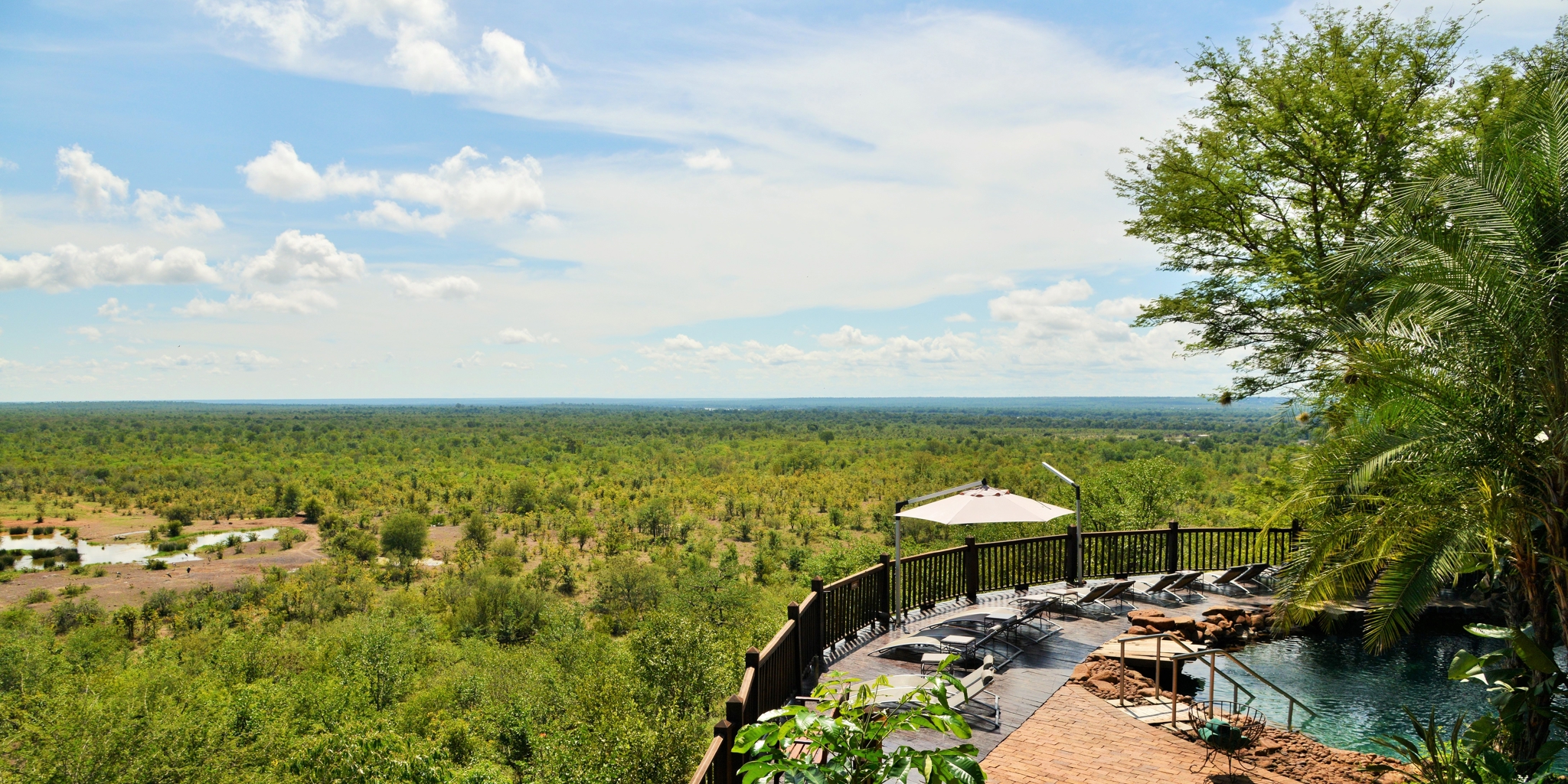 Swimming Pool and waterhole at Victoria Falls Safari Lodge