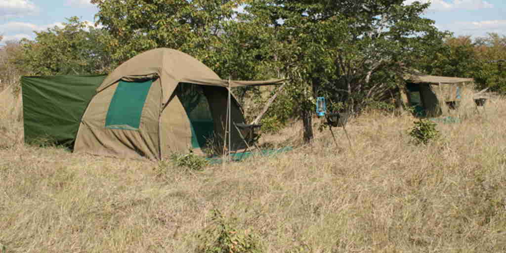 Semi Lux tent with long drop toilet en suite