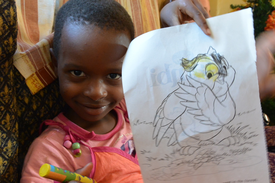 Young Girl Colouring an Image of an Owl