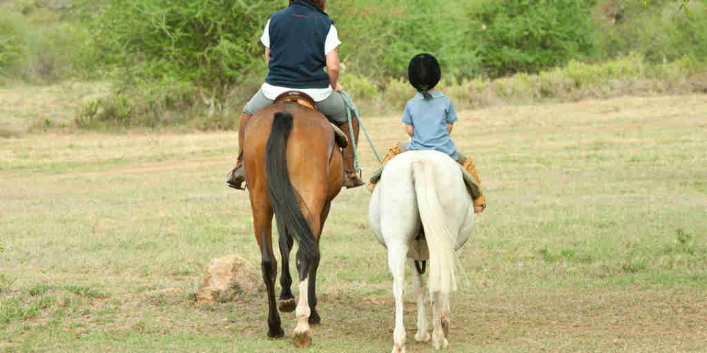 Sosian children horse riding
