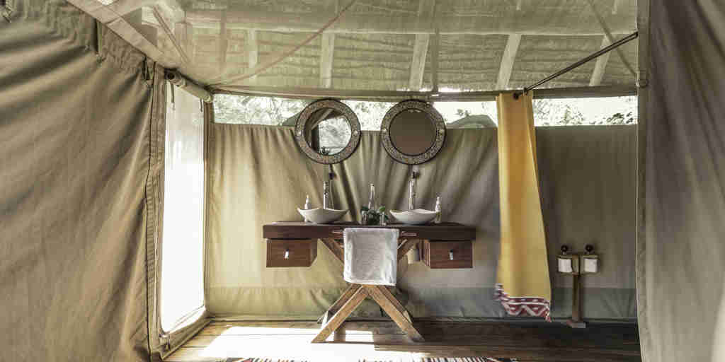 tent bathroom basecamp maasai mara kenya yellow zebra safaris