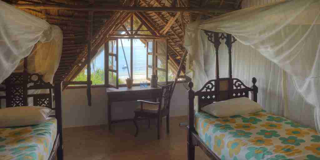 twin bedroom upstairs matemwe beach house tanzania yellow zebra safaris