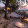 camp linyanti botswana camp fire yellow zebra safaris