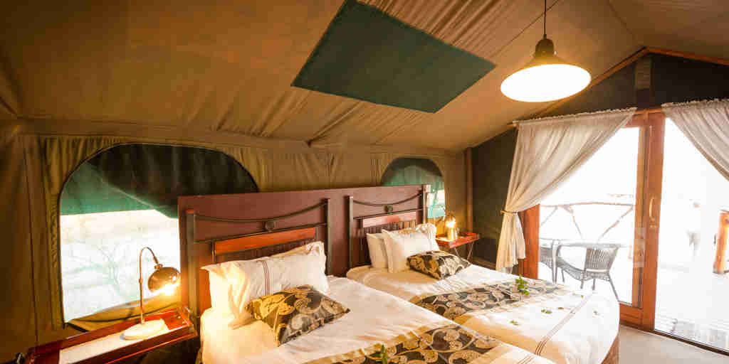 camp savuti botswana twin bedroom yellow zebra safaris