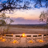 kwara camp fire seating botswana yellow zebra safaris