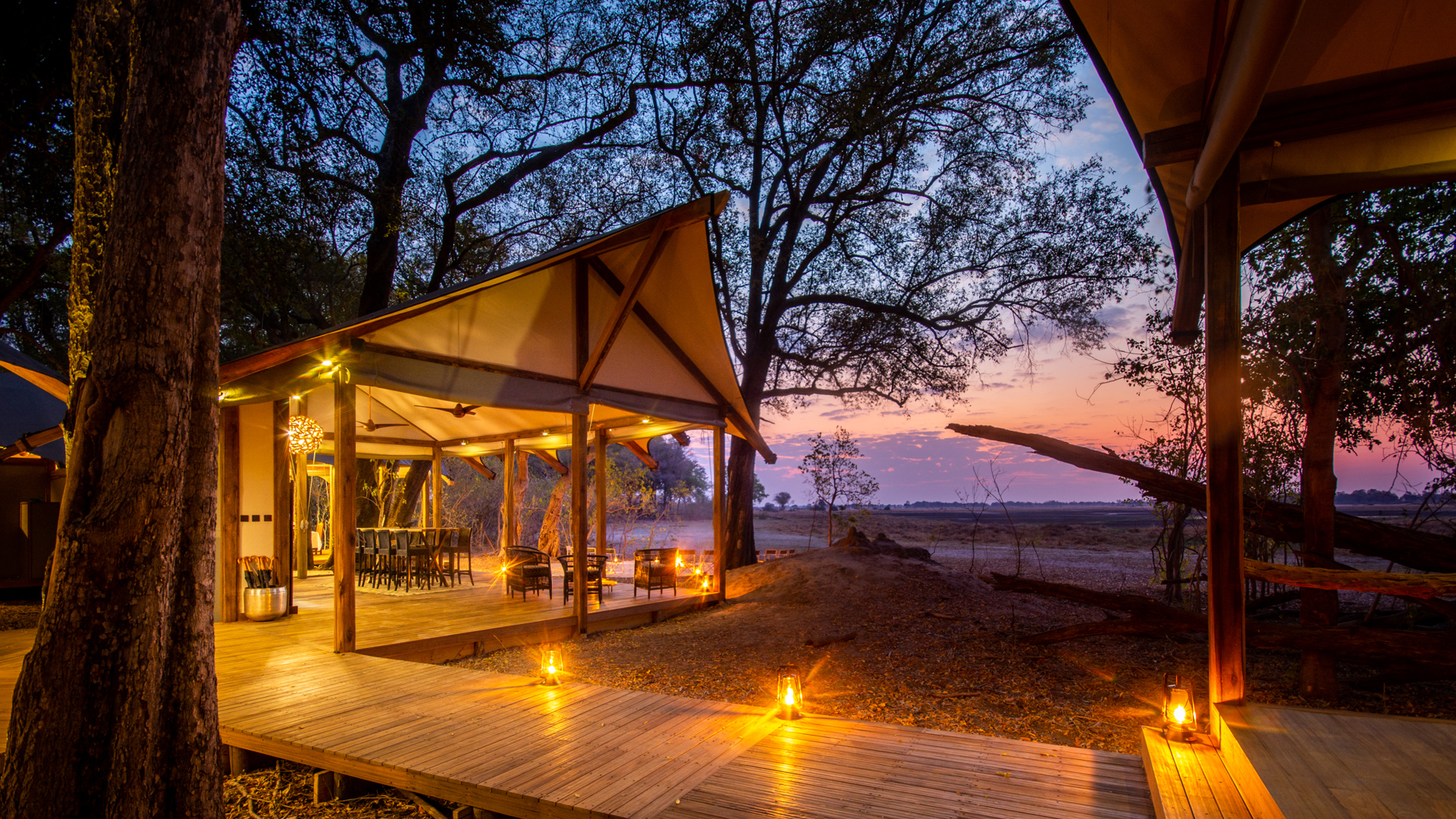 kwara camp main area sunset botswana yellow zebra safaris