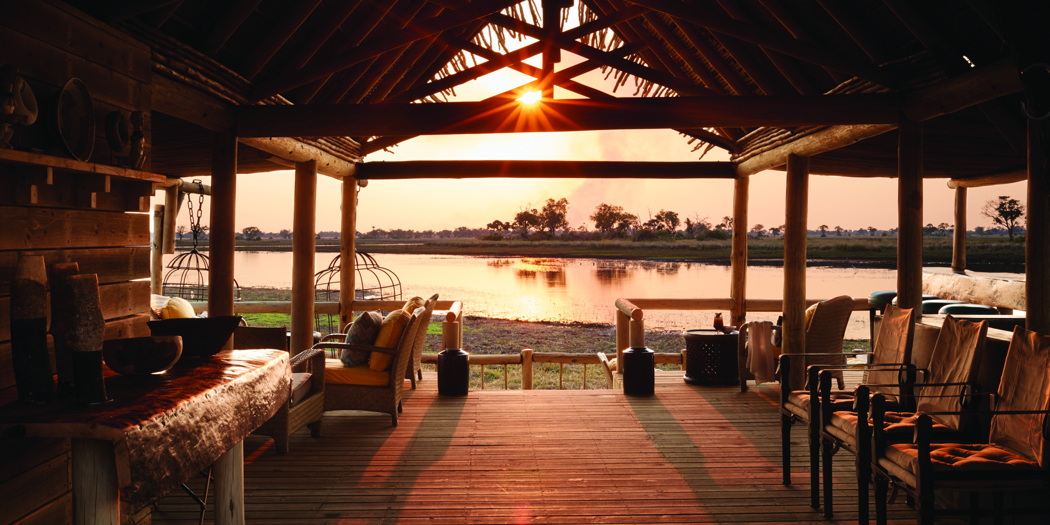 belmond eagle island lodge botswana sunset yellow zebra safaris