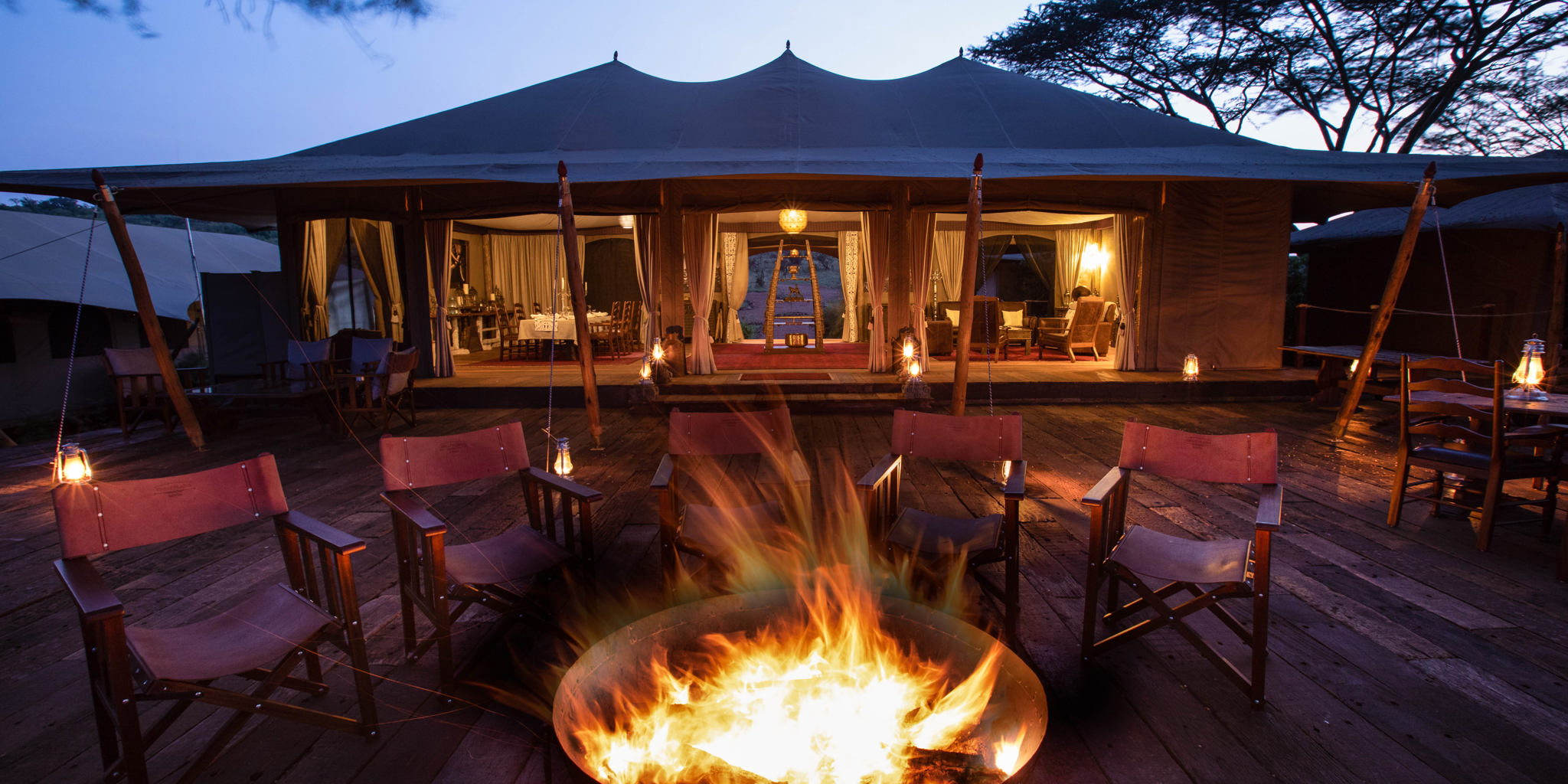 mara nyika kenya camp fire yellow zebra safaris