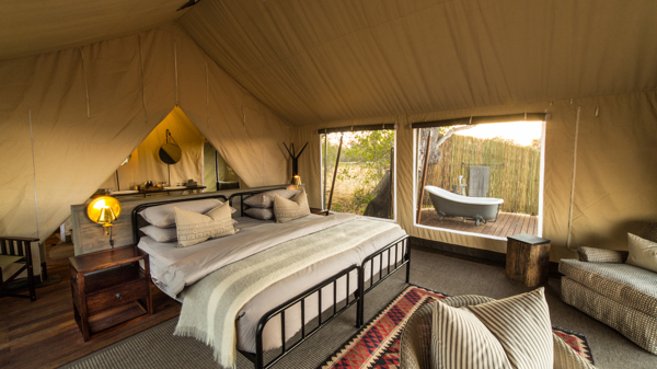 little machaba main bedroom botswana yellow zebra safaris