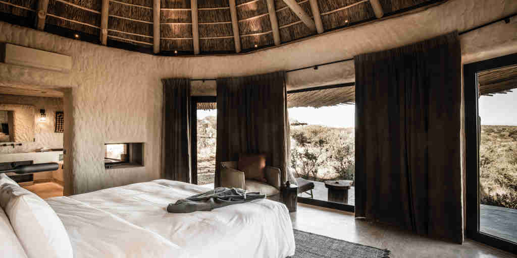 omaanda windhoek namibia bedroom view yellow zebra safaris