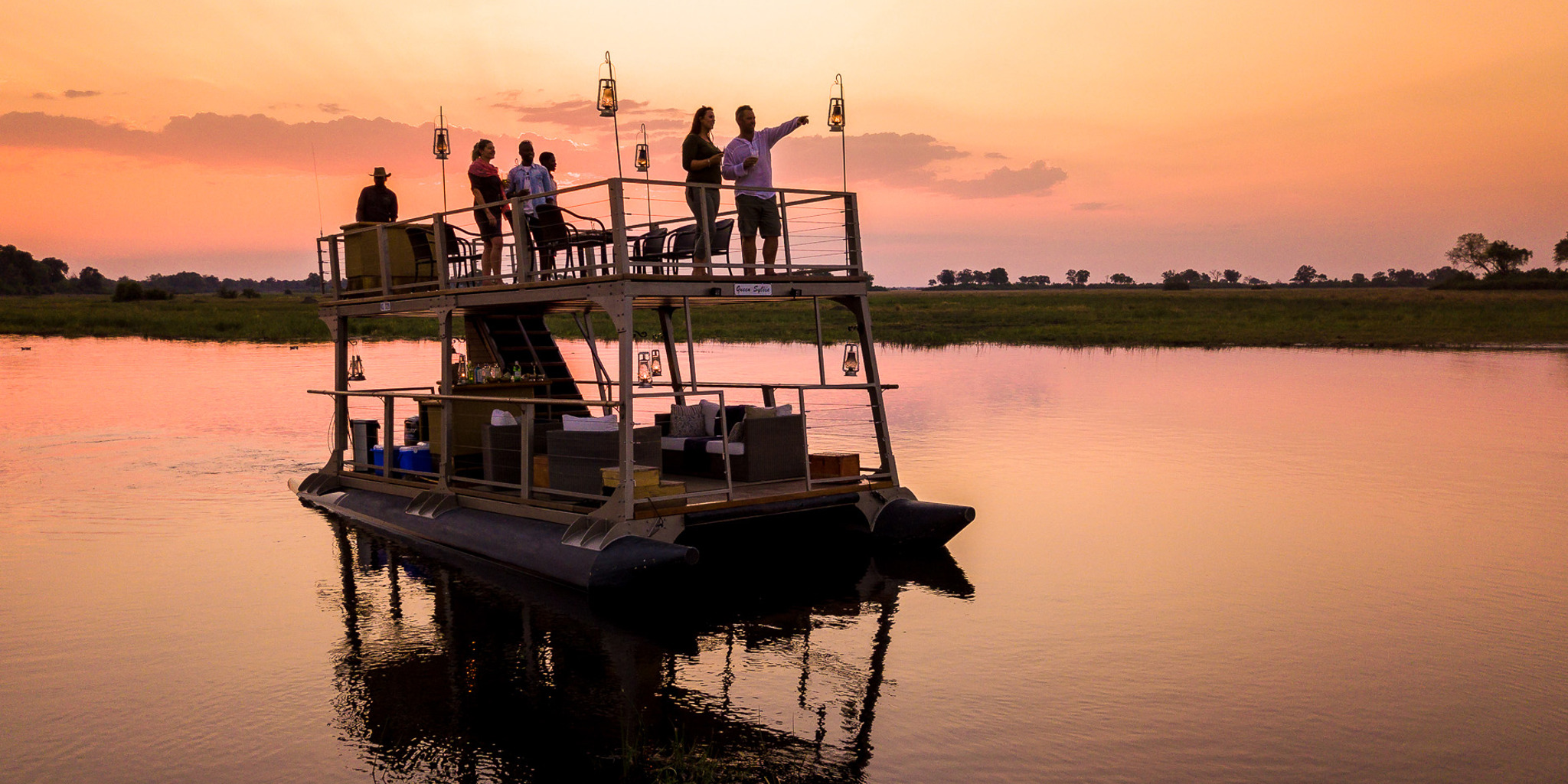 kings pool botswana boat trip sunset yellow zebra safaris