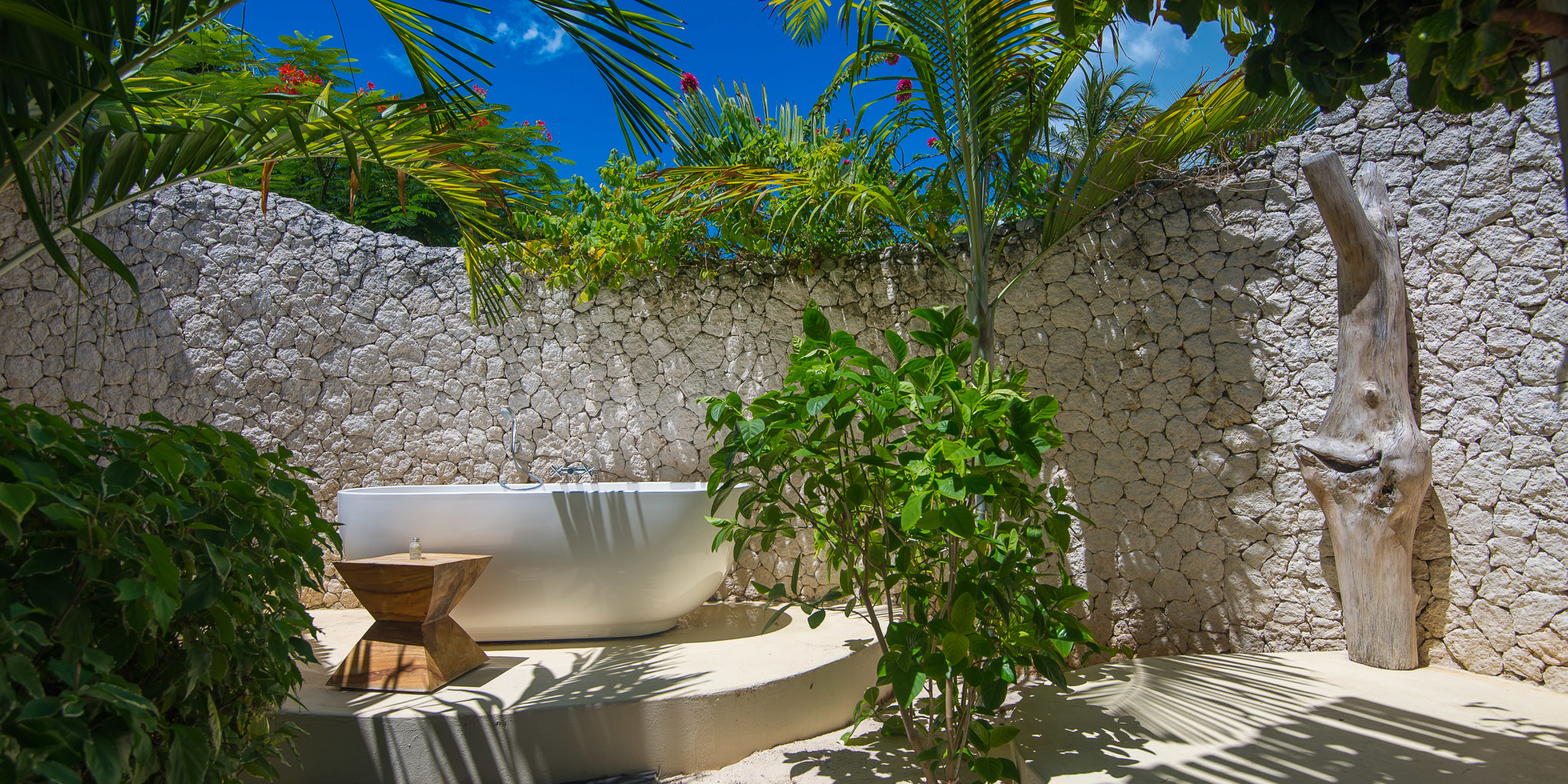 white sand villas outdoor bathtub zanzibar tanzania yellow zebra safaris