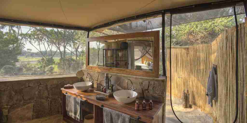 roho y selous bathroom tanzania yellow zebra safaris