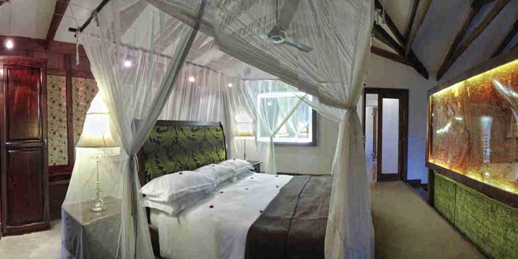 Arusha coffee lodge bedroom tanzania yellow zebra safaris