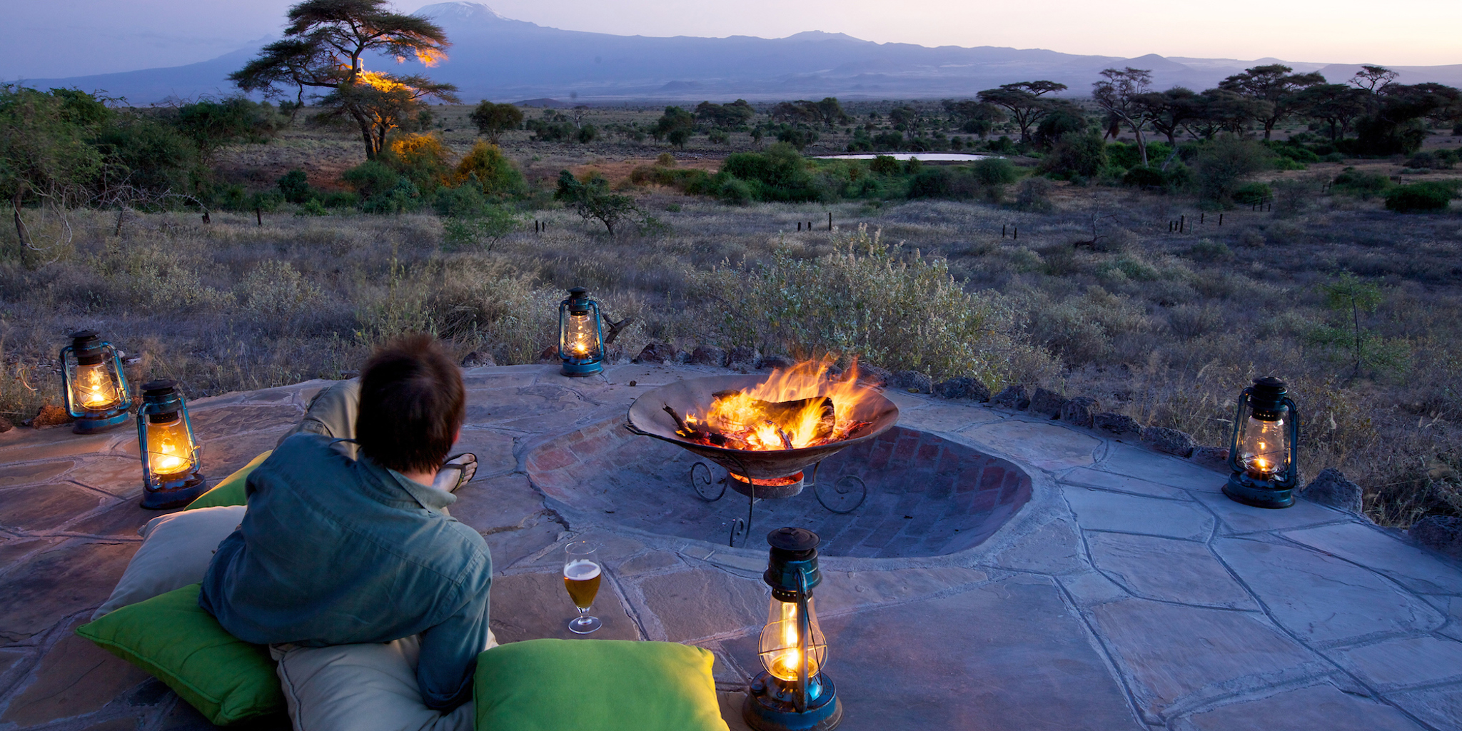 tortilis camp camp fire kenya yellow zebra safaris