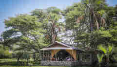 chem chem safari lodge tent exterior tanzania yellow zebra safaris