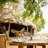 Sand Rivers Camp Selous dining yellow zebra safaris