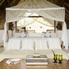 Sand Rivers Camp Selous double bed yellow zebra safaris