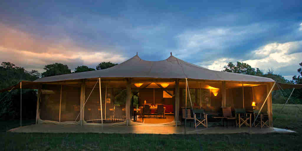 porini lion camp tent exterior kenya yellow zebra safaris