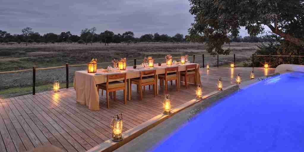 lion camp night dining zambia yellow zebra safaris