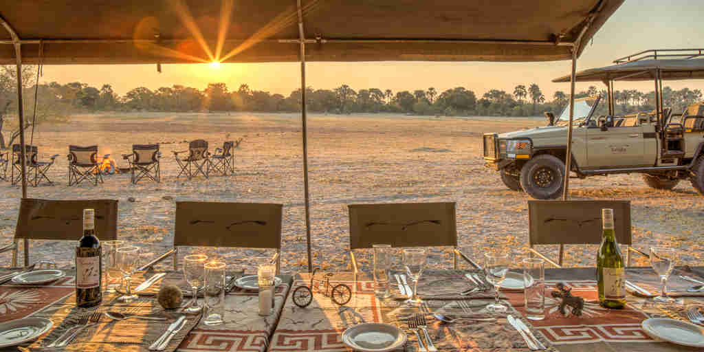 letaka safaris dining sunset botswana yellow zebra safaris
