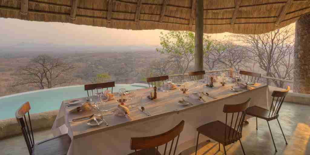 ikuka safari camp dining table tanzania yellow zebra safaris