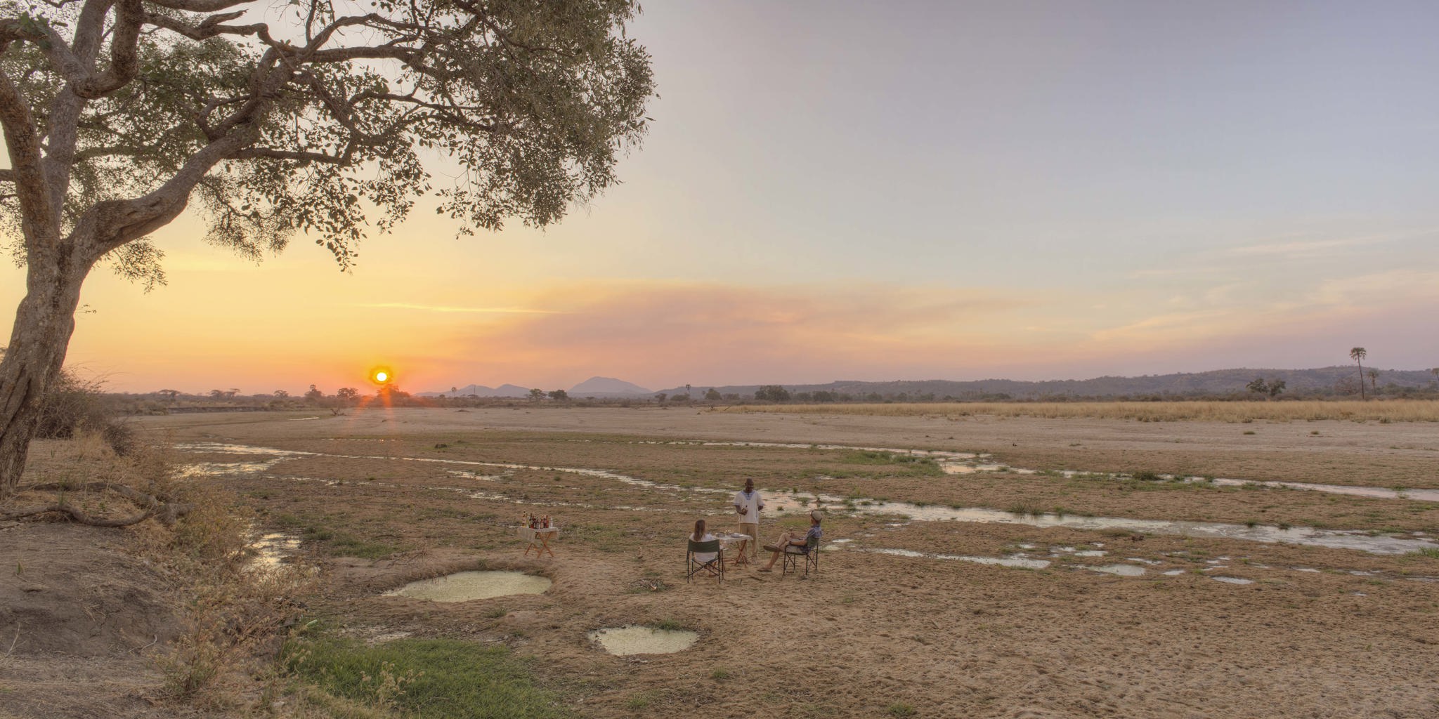 ikuka safari camp sundowners tanzania yellow zebra safaris