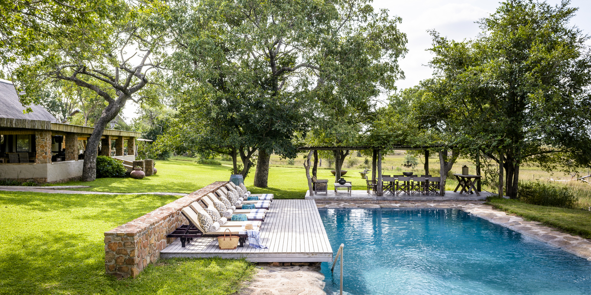singita castleton outside dining pool area yellow zebra safaris