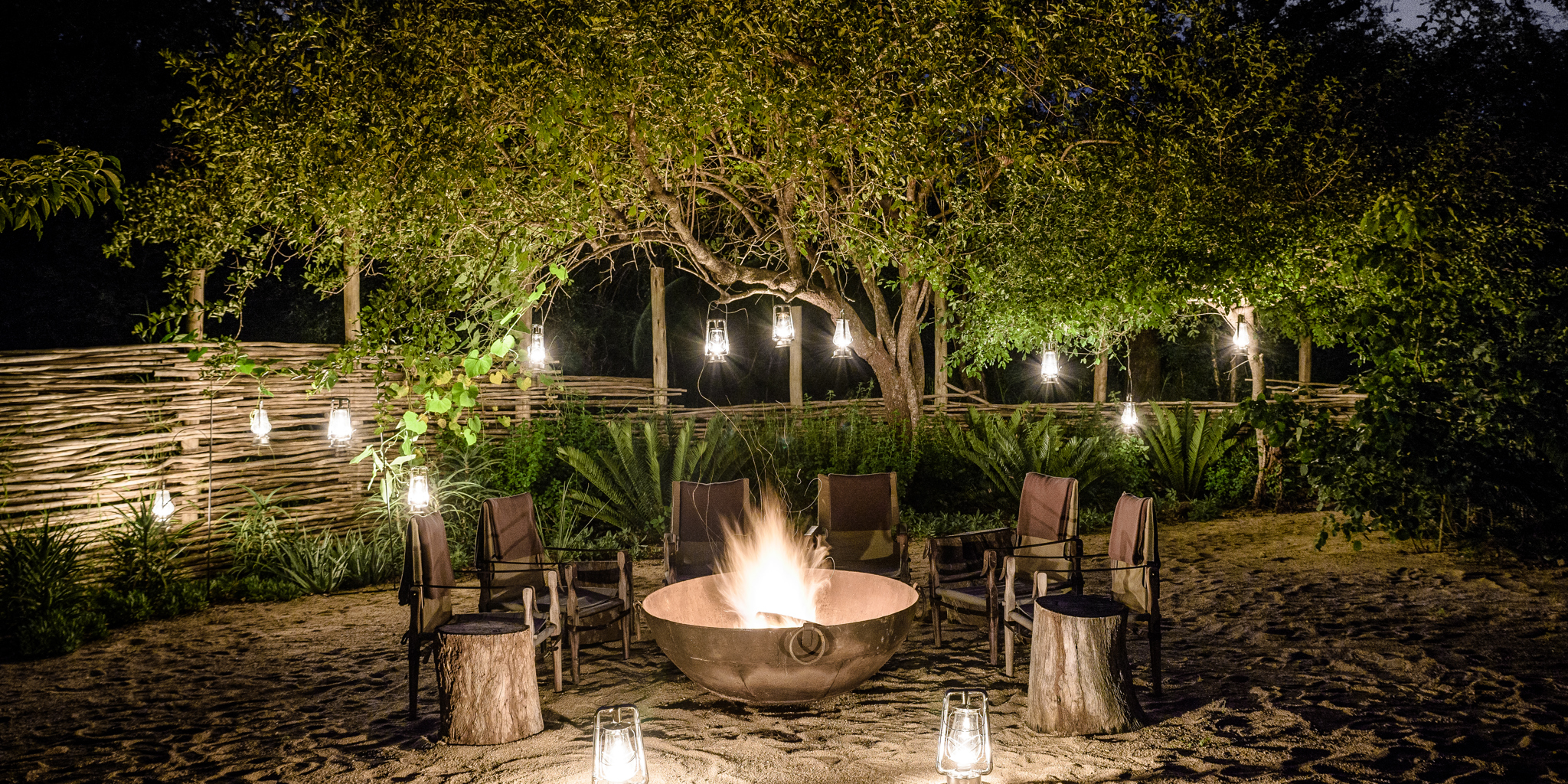 singita ebony lodge night camp fire south africa yellow zebra safaris