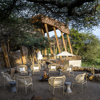 singita faru faru camp fire tanzania yellow zebra safaris