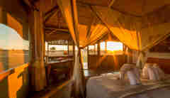camp hwange bedroom sunset zimbabwe yellow zebra safaris
