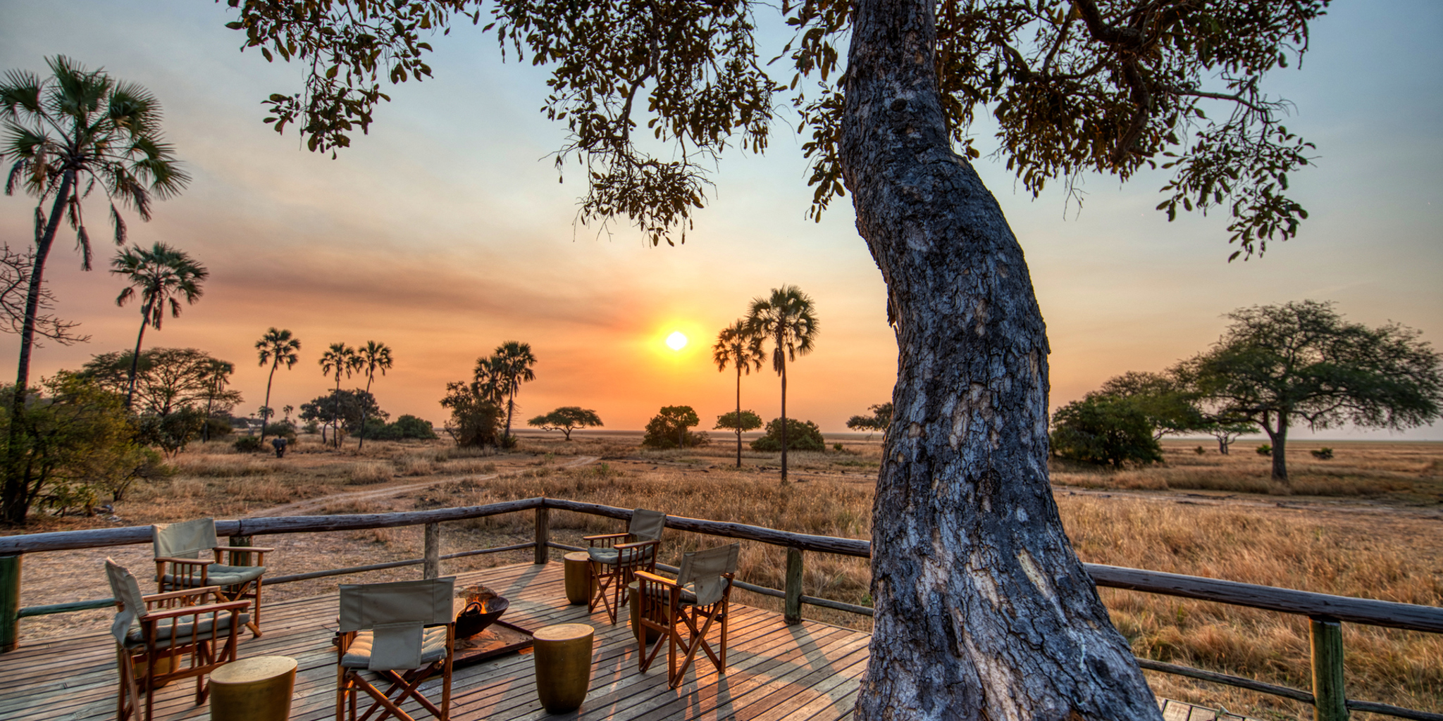 mbali mbali katavi camp fire sunset tanzania yellow zebra safaris