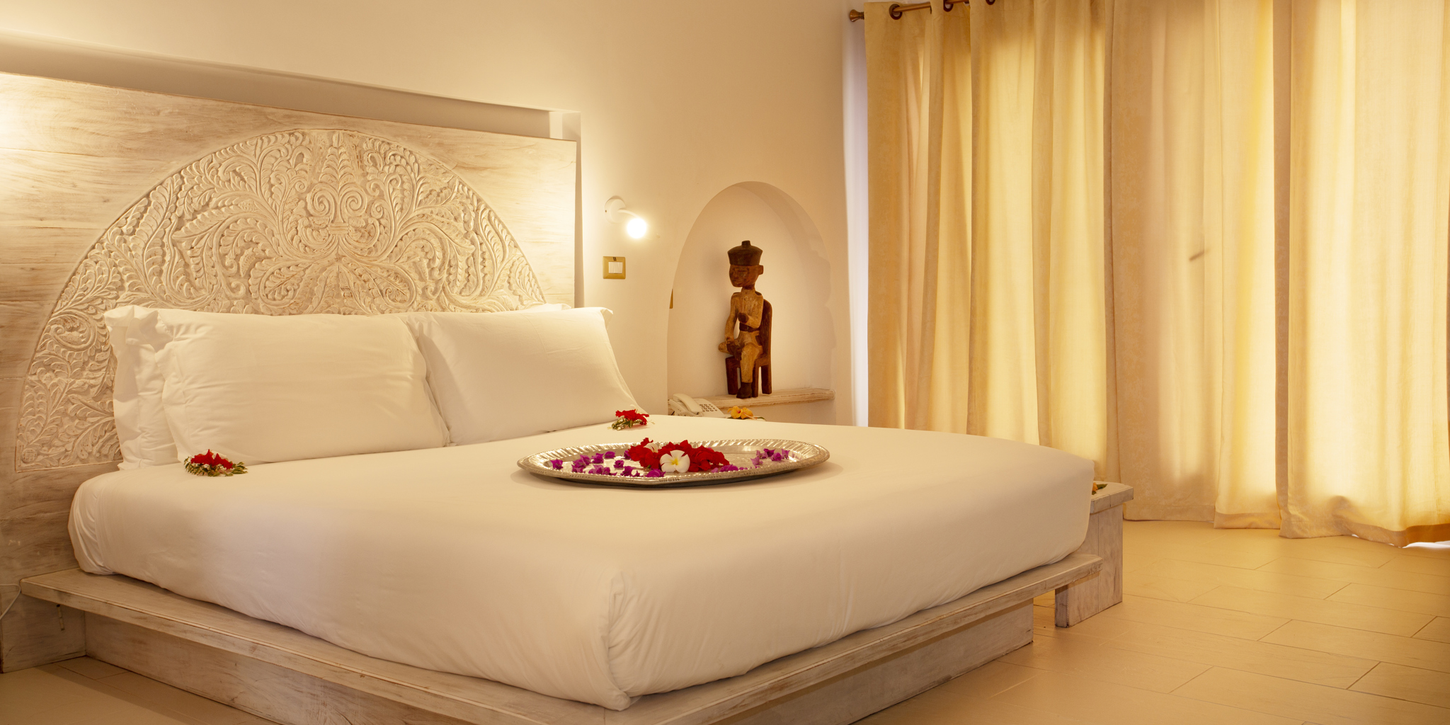 gold zanzibar villa bed tanzania yellow zebra safaris