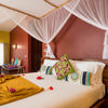 gold zanzibar king bed tanzania yellow zebra safaris