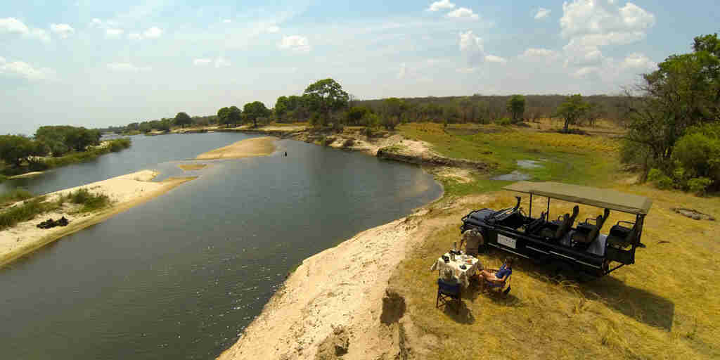 zambezi sands river camp bush dinner zimbabwe yellow zebra safaris