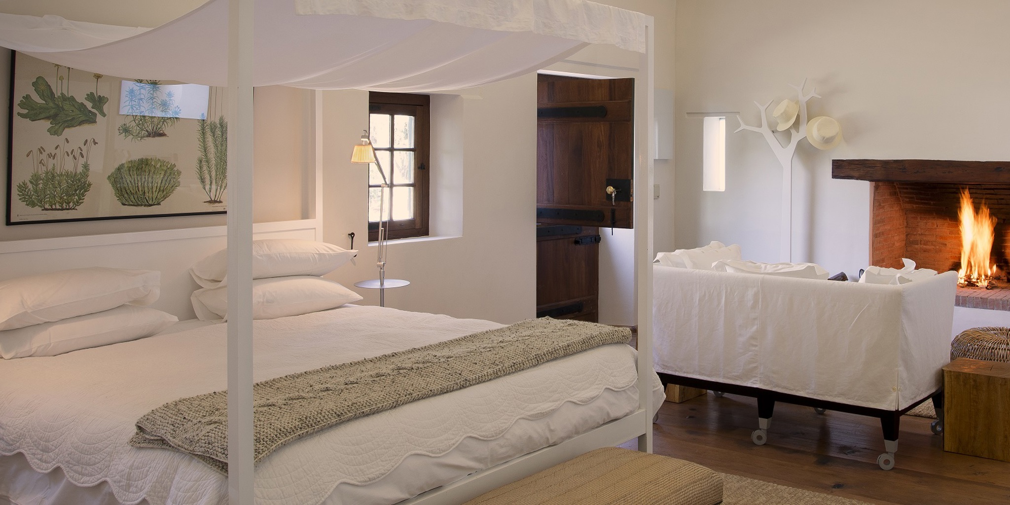 Cottage bedroom with fireplace, Babylonstoren, South Africa