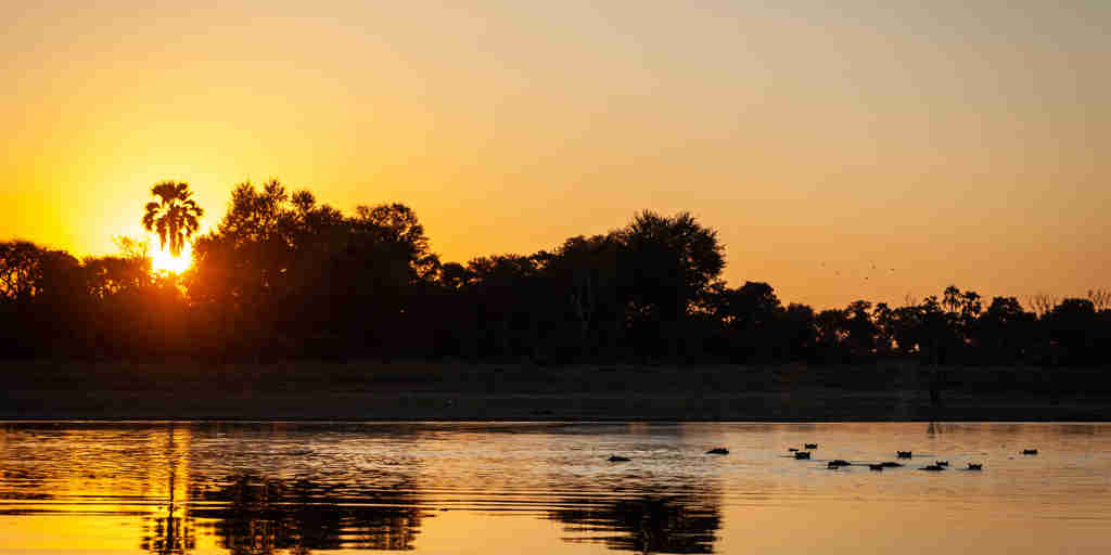 sunset, kiri camp, okovango delta, botswana