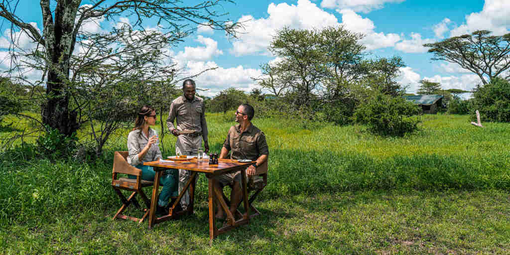 outside meals, camp fire, lemala mara, the serengeti, tanzania