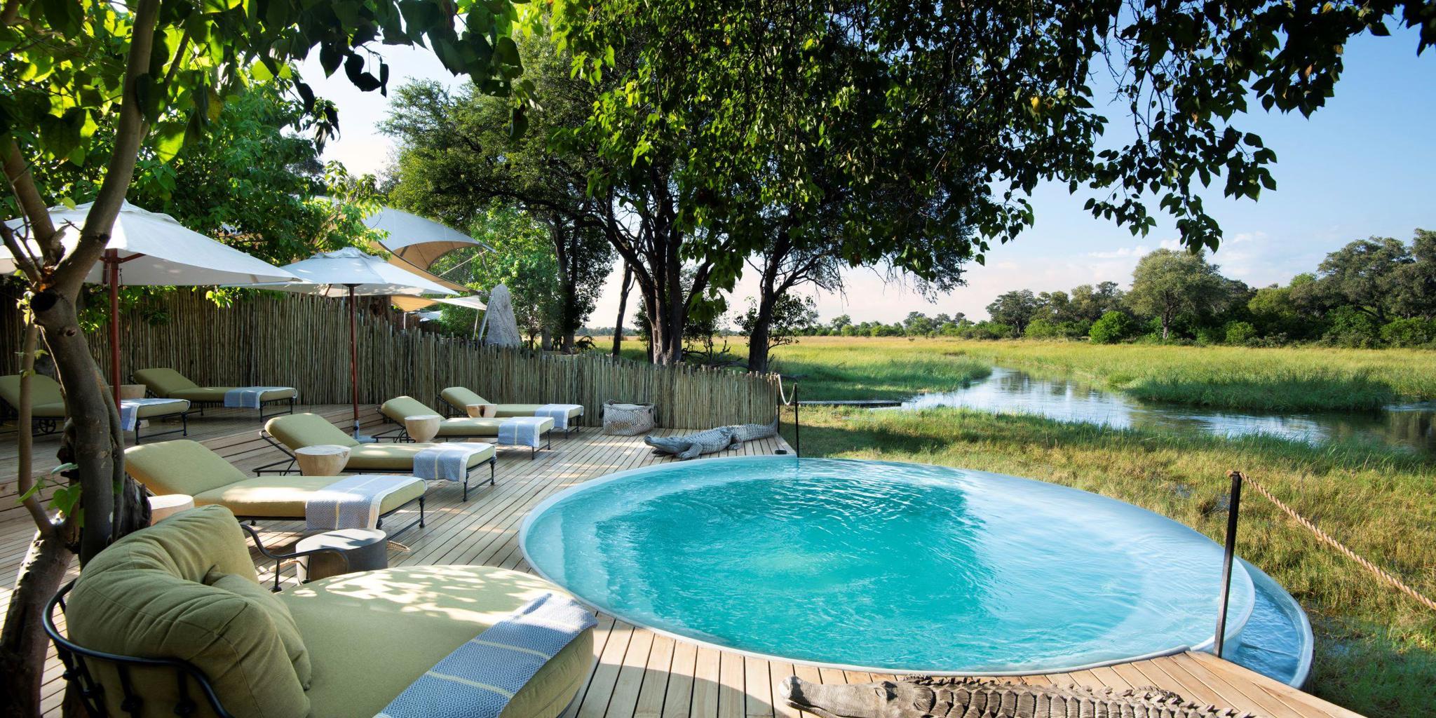 pool area, Khwai leadwood under thatch, botswana