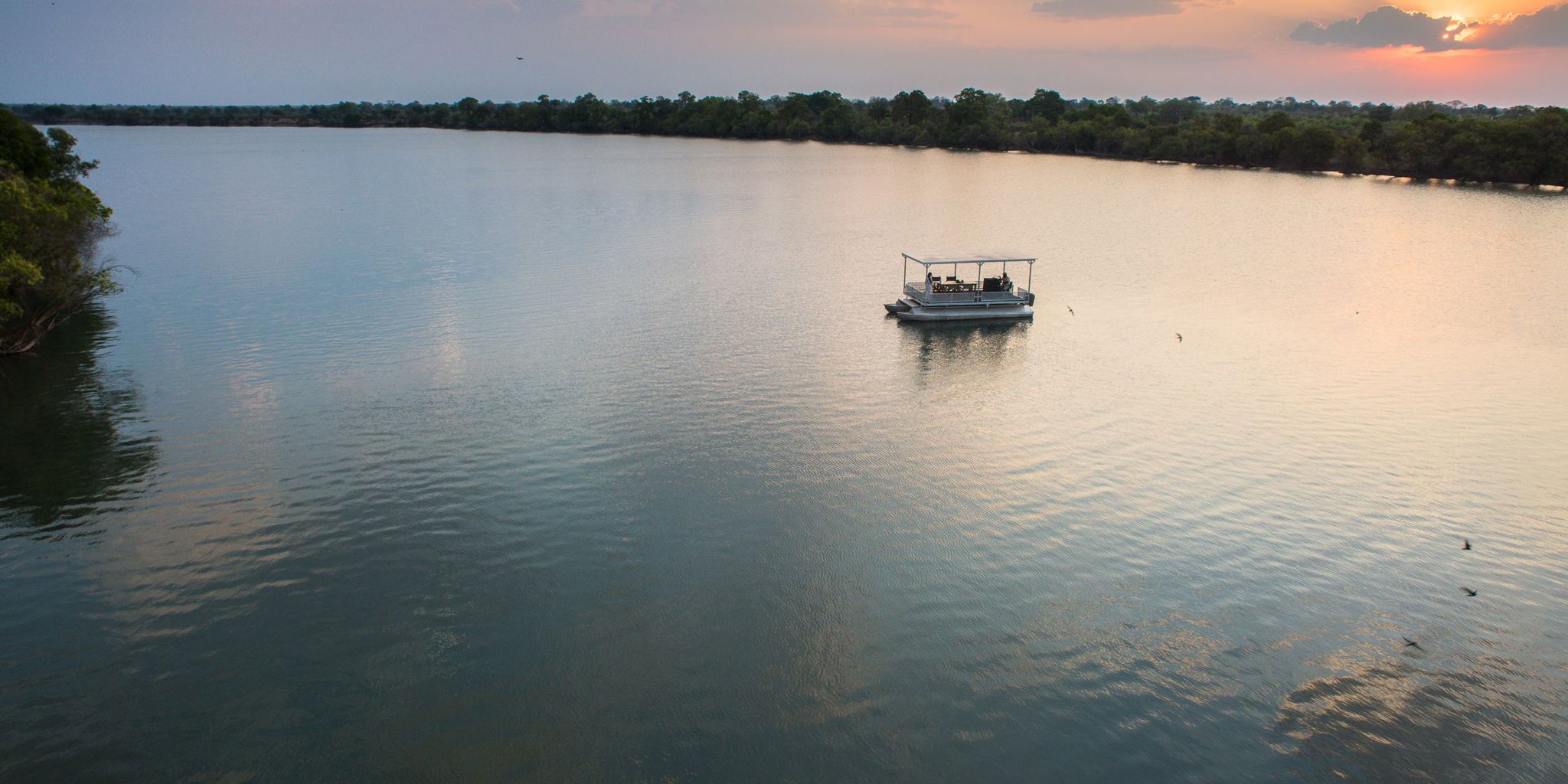 sunset cruise, ila safari lodge, kafue national park, zambia