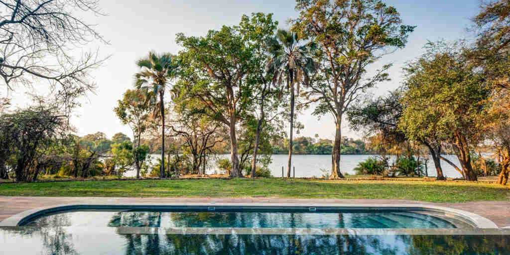Pool and riverside view, Palm River Lodge, Zimbabwe