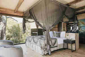 family room bed, vumbura plains, okavango delta, botswana